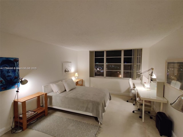 carpeted bedroom with baseboards