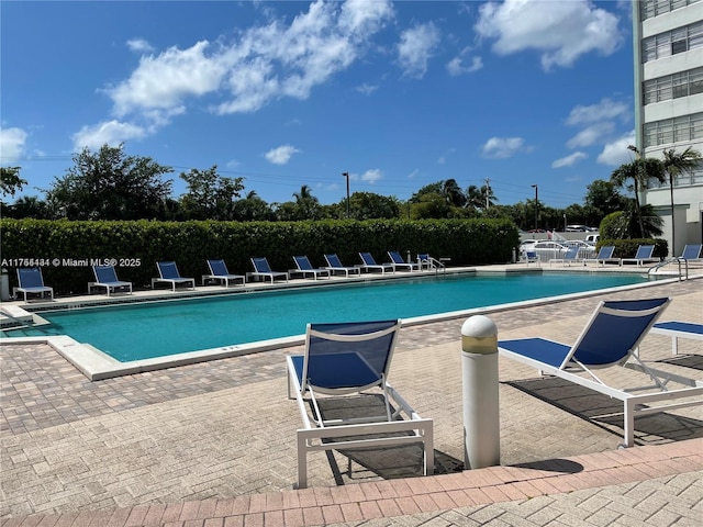 community pool featuring a patio