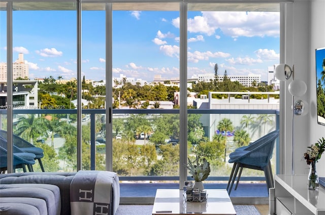 sunroom / solarium featuring a city view