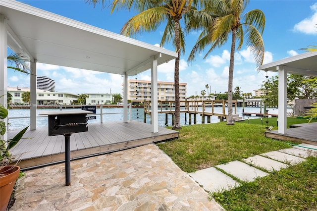 dock area featuring a yard and a water view