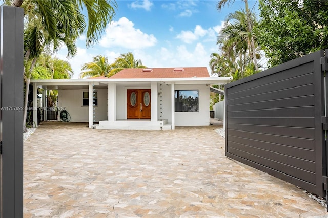 back of property with stucco siding