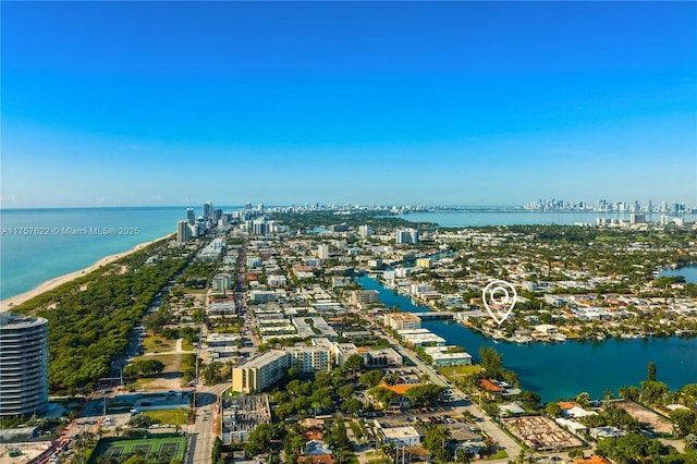 birds eye view of property featuring a city view and a water view