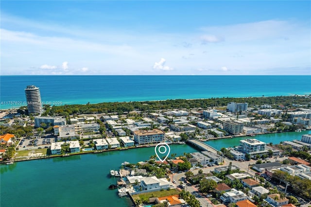 drone / aerial view with a city view and a water view