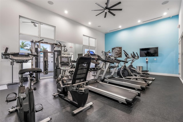 exercise room with a ceiling fan, recessed lighting, and baseboards