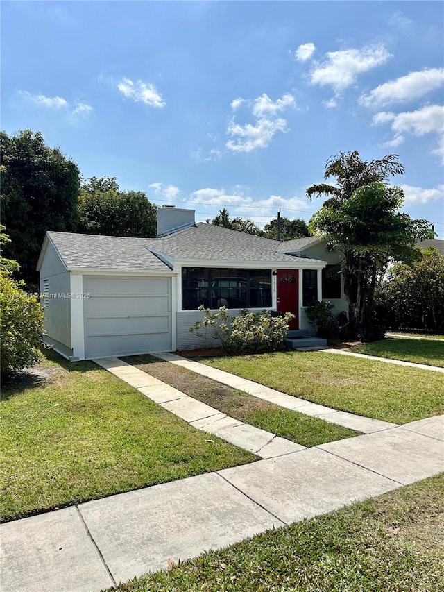 ranch-style house featuring an attached garage, a shingled roof, a chimney, a front lawn, and stucco siding