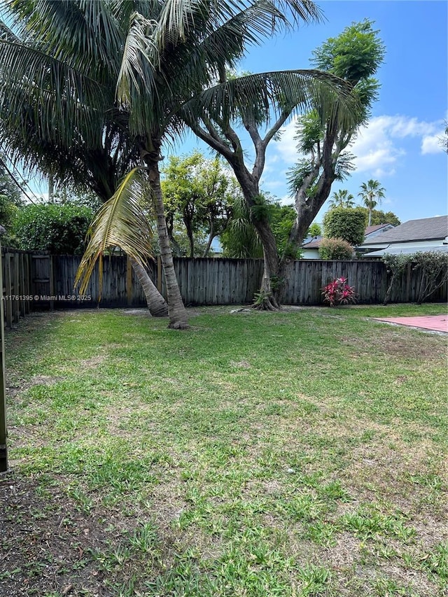 view of yard with a fenced backyard