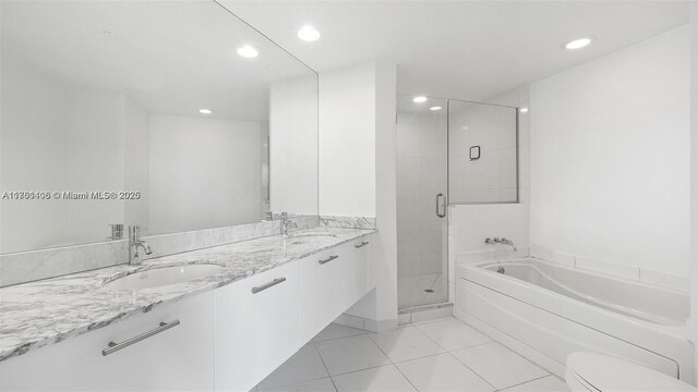 55 SE 6th St Unit 3701, Miami, FL 33131 - full bath featuring a shower stall, a garden tub, recessed lighting, and a sink