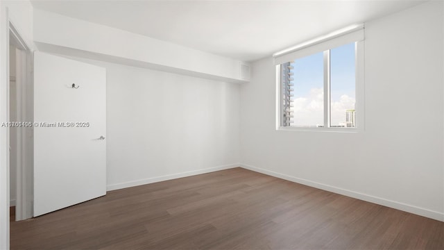 55 SE 6th St Unit 3701, Miami, FL 33131 - unfurnished room featuring wood finished floors and baseboards