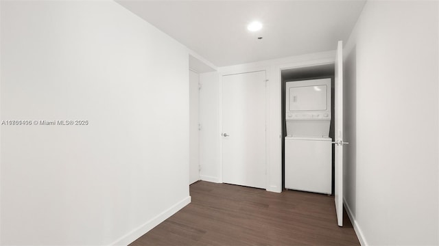 55 SE 6th St Unit 3701, Miami, FL 33131 - hall featuring stacked washing maching and dryer, dark wood-type flooring, and baseboards