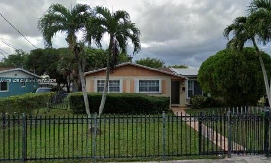 view of front of house featuring a front lawn and a fenced front yard