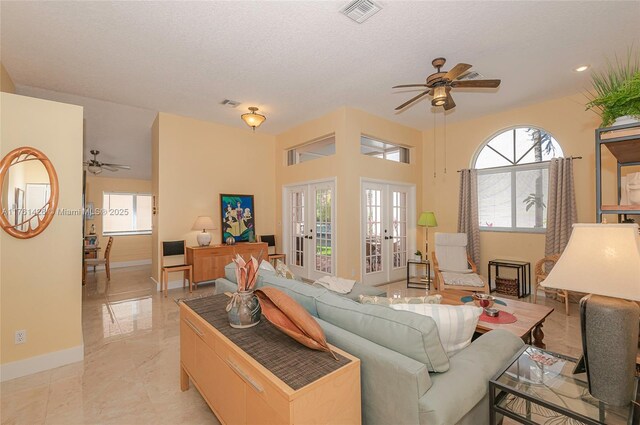 1154 SE 6th Ct, Dania Beach, FL 33004 - living room with a ceiling fan, french doors, visible vents, and a healthy amount of sunlight