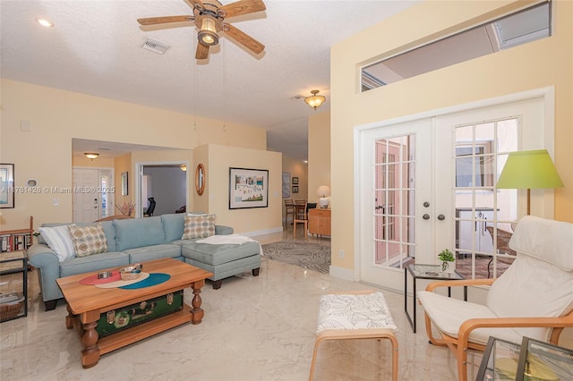 1154 SE 6th Ct, Dania Beach, FL 33004 - living room with visible vents, baseboards, french doors, marble finish floor, and a textured ceiling