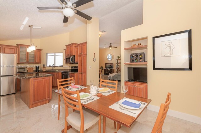 1154 SE 6th Ct, Dania Beach, FL 33004 - dining room featuring built in shelves, marble finish floor, lofted ceiling, a textured ceiling, and baseboards