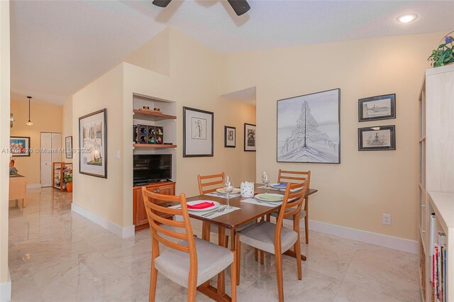 1154 SE 6th Ct, Dania Beach, FL 33004 - dining room featuring marble finish floor, ceiling fan, baseboards, and vaulted ceiling
