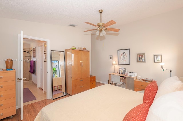 1154 SE 6th Ct, Dania Beach, FL 33004 - bedroom with ceiling fan, visible vents, light wood-type flooring, and a textured ceiling