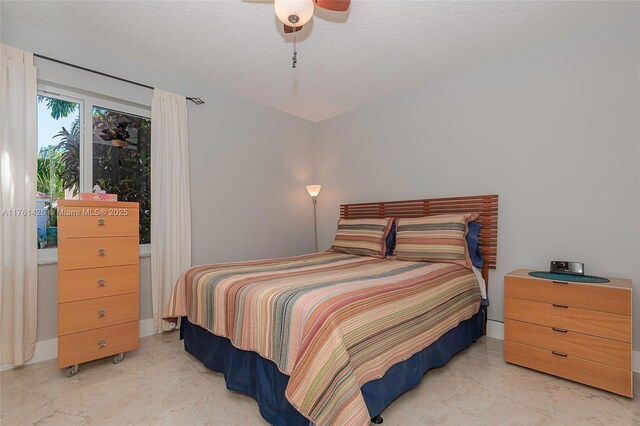1154 SE 6th Ct, Dania Beach, FL 33004 - bedroom with a textured ceiling and a ceiling fan