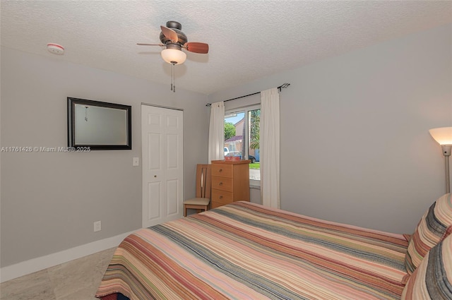 1154 SE 6th Ct, Dania Beach, FL 33004 - bedroom with a closet, baseboards, a textured ceiling, and a ceiling fan