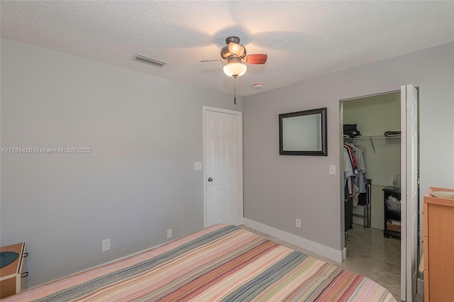 1154 SE 6th Ct, Dania Beach, FL 33004 - bedroom featuring baseboards, visible vents, a spacious closet, a closet, and a textured ceiling