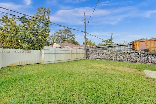 view of yard with a fenced backyard