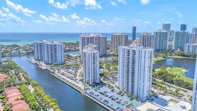 birds eye view of property with a city view and a water view