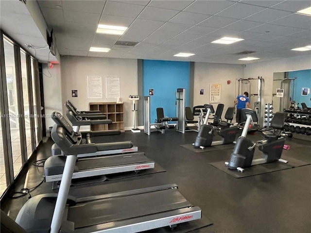 gym featuring a paneled ceiling