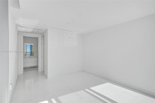 empty room featuring light tile patterned floors