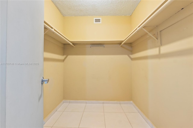 401 Golden Isles Dr Unit 516, Hallandale Beach, FL 33009 - walk in closet featuring light tile patterned flooring