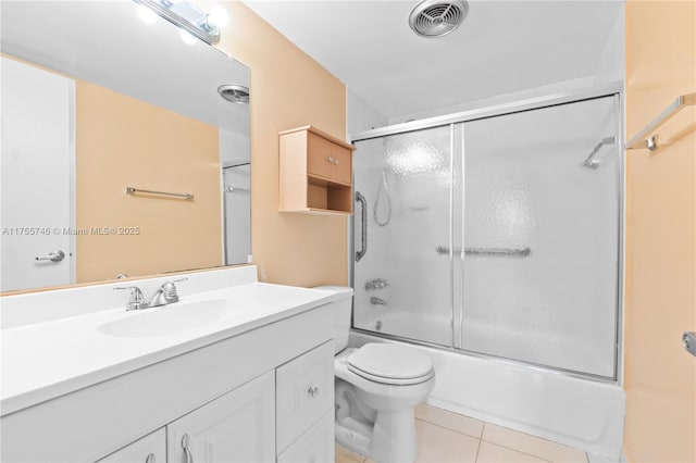 401 Golden Isles Dr Unit 516, Hallandale Beach, FL 33009 - bathroom featuring vanity, tile patterned floors, and combined bath / shower with glass door