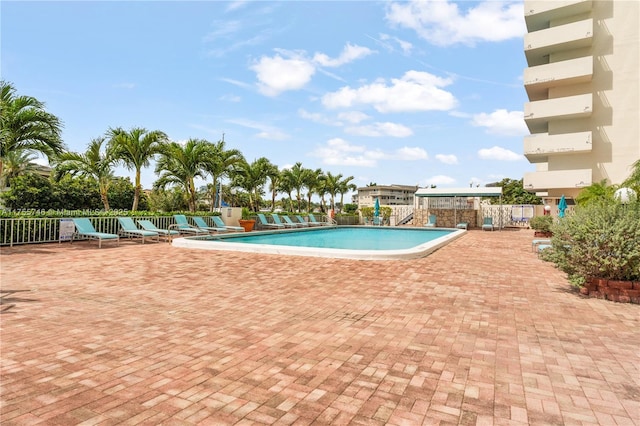 401 Golden Isles Dr Unit 516, Hallandale Beach, FL 33009 - community pool with a patio area
