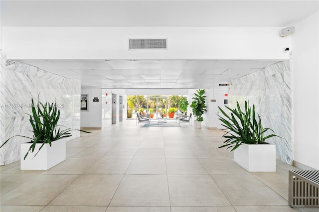 401 Golden Isles Dr Unit 516, Hallandale Beach, FL 33009 - community lobby featuring a surveillance system