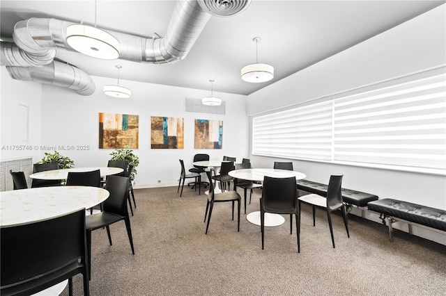 401 Golden Isles Dr Unit 516, Hallandale Beach, FL 33009 - dining area featuring carpet floors and vaulted ceiling