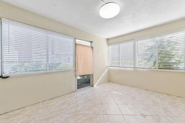 spare room featuring tile patterned floors