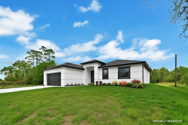 105 E 14th St, Lehigh Acres, FL 33972 - view of front of home with concrete driveway, an attached garage, a front yard, and stucco siding