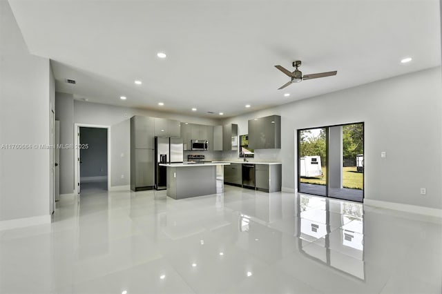 105 E 14th St, Lehigh Acres, FL 33972 - kitchen featuring appliances with stainless steel finishes, modern cabinets, gray cabinetry, light tile patterned floors, and recessed lighting