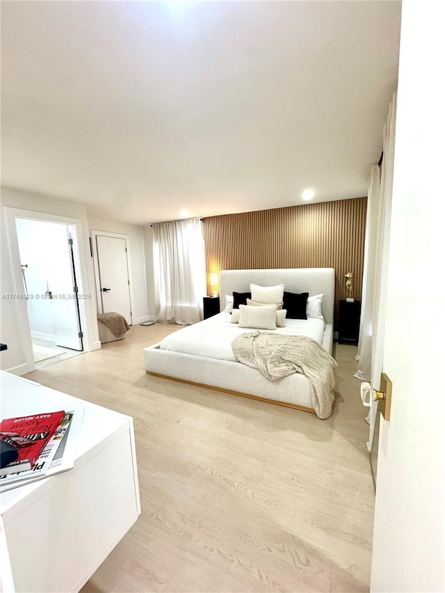 bedroom featuring light wood-style flooring
