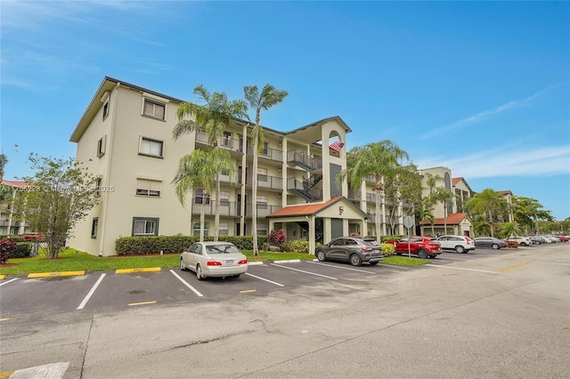 view of property with uncovered parking