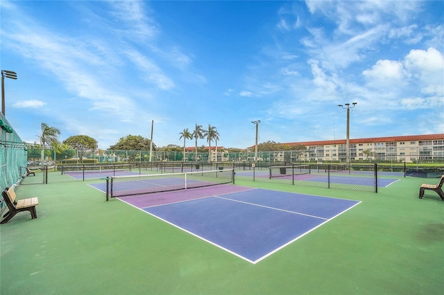 view of sport court with fence