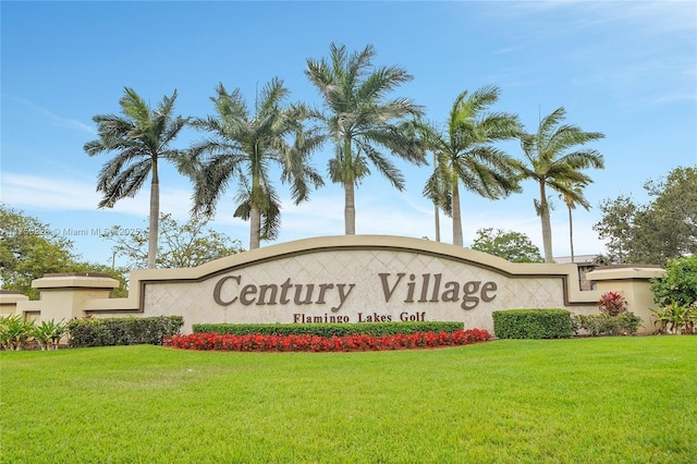 community / neighborhood sign featuring a yard