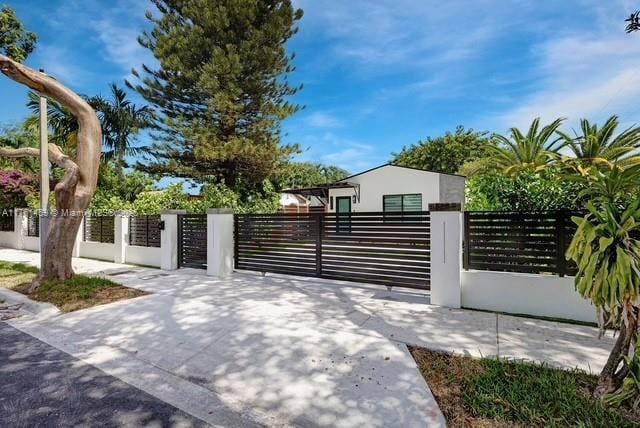 view of gate featuring a fenced front yard