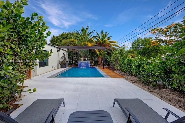 pool with a patio