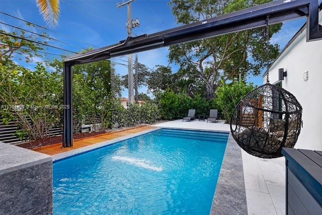 pool with a patio