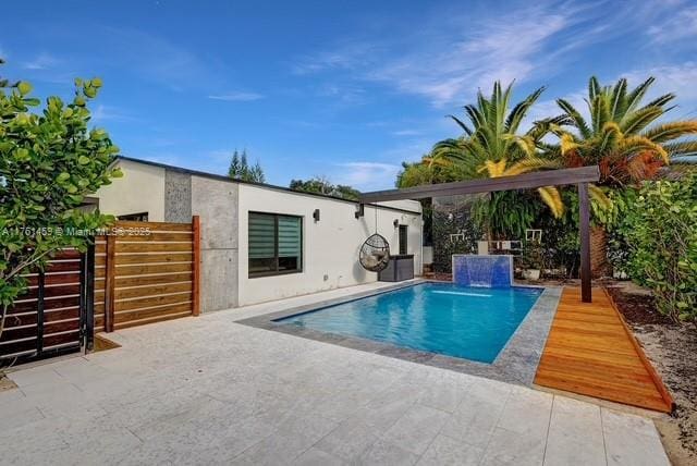 view of swimming pool featuring a fenced in pool, a patio, and fence