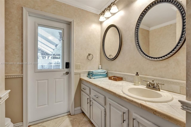 bathroom featuring vanity, tile patterned floors, and ornamental molding