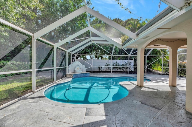 view of swimming pool with a lanai, a patio area, a fenced in pool, and a fenced backyard