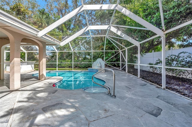 view of pool featuring a fenced in pool, glass enclosure, a patio, and fence