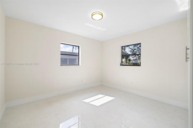 empty room with baseboards