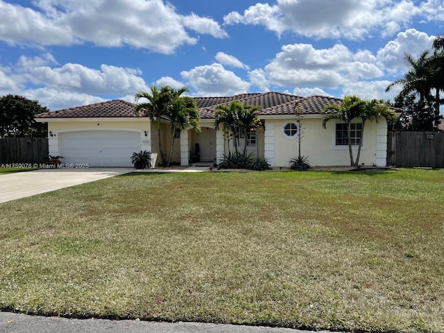 view of front of property featuring an attached garage, a tile roof, and fence