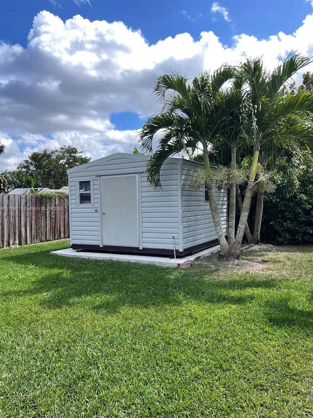 view of shed with fence