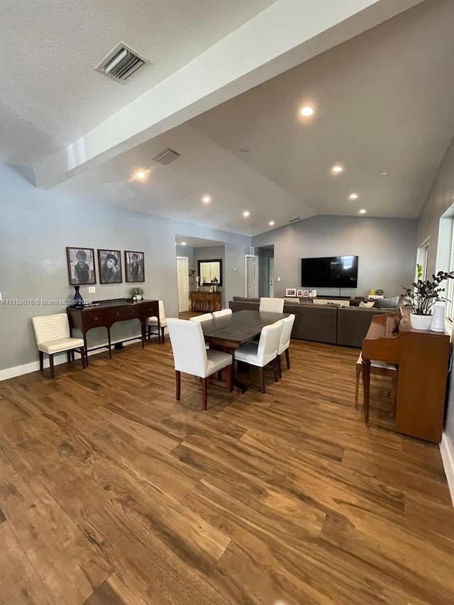 dining area featuring recessed lighting, visible vents, lofted ceiling, and wood finished floors