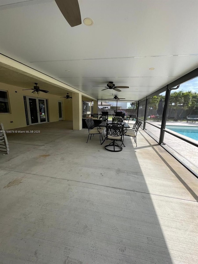 view of patio / terrace featuring a community pool and a ceiling fan